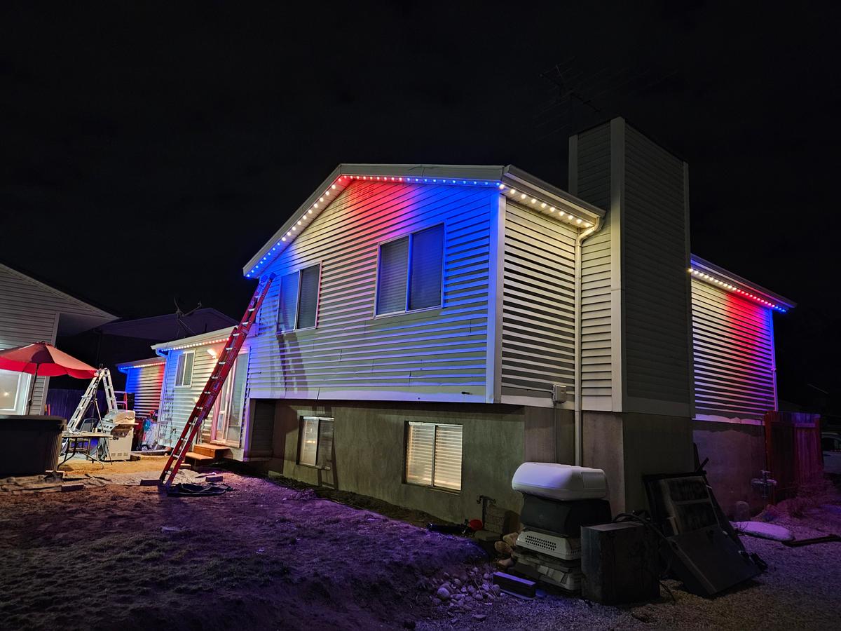 Custom red and blue LED roofline at night