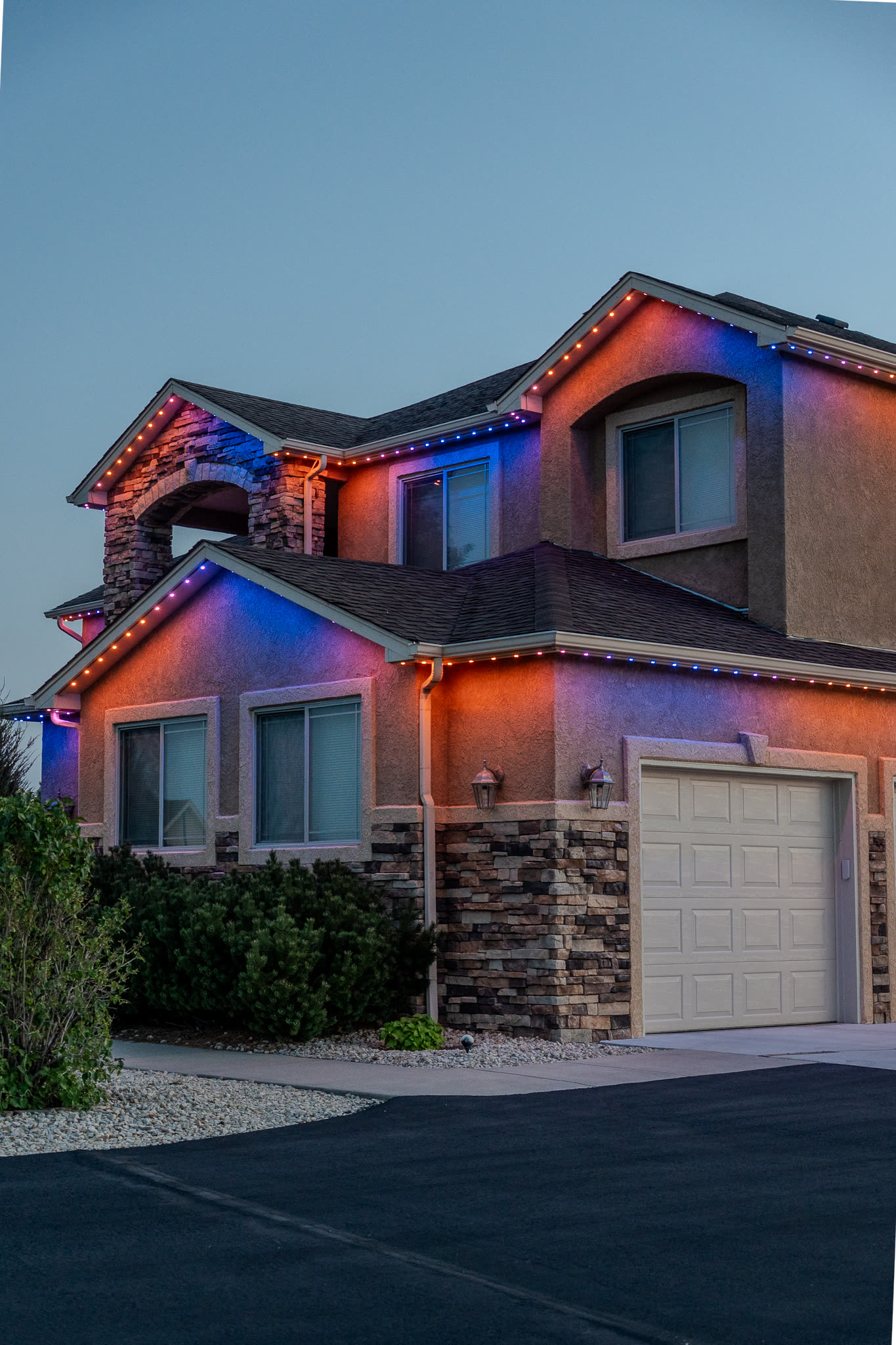 Home with red and blue permanent LED lighting for game day
