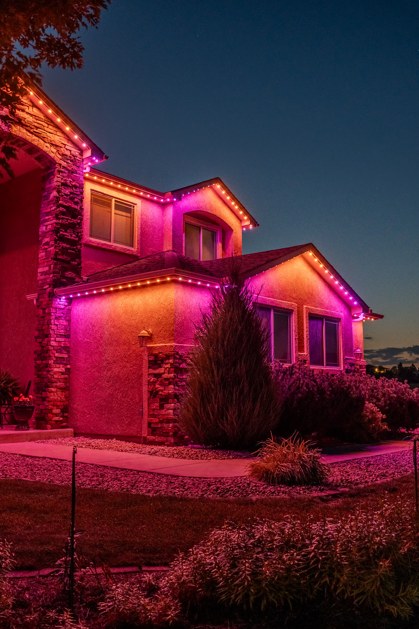 Home with purple and orange permanent LED lighting for Halloween