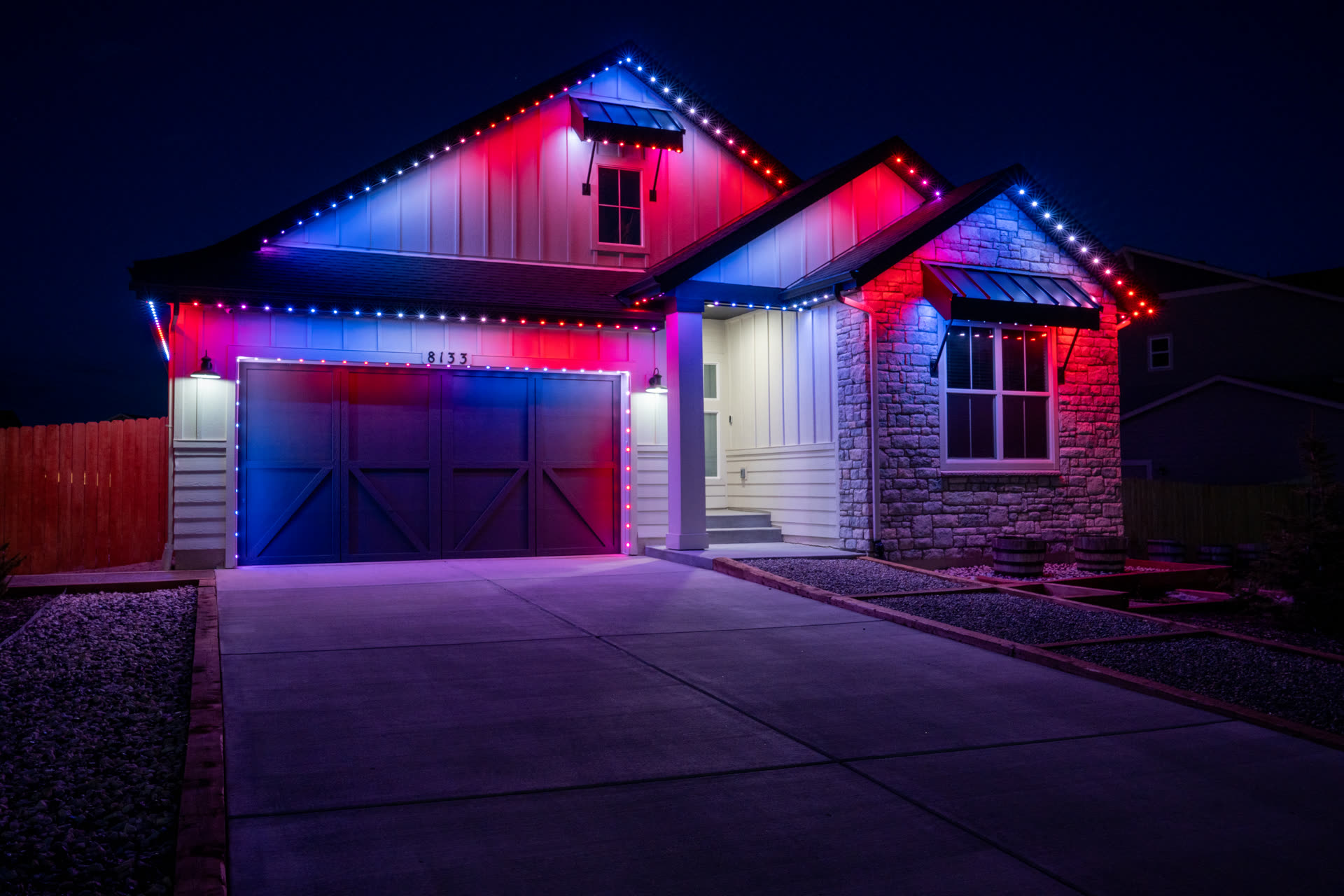 Home with red, white, and blue permanent LED lighting for the 4th of July