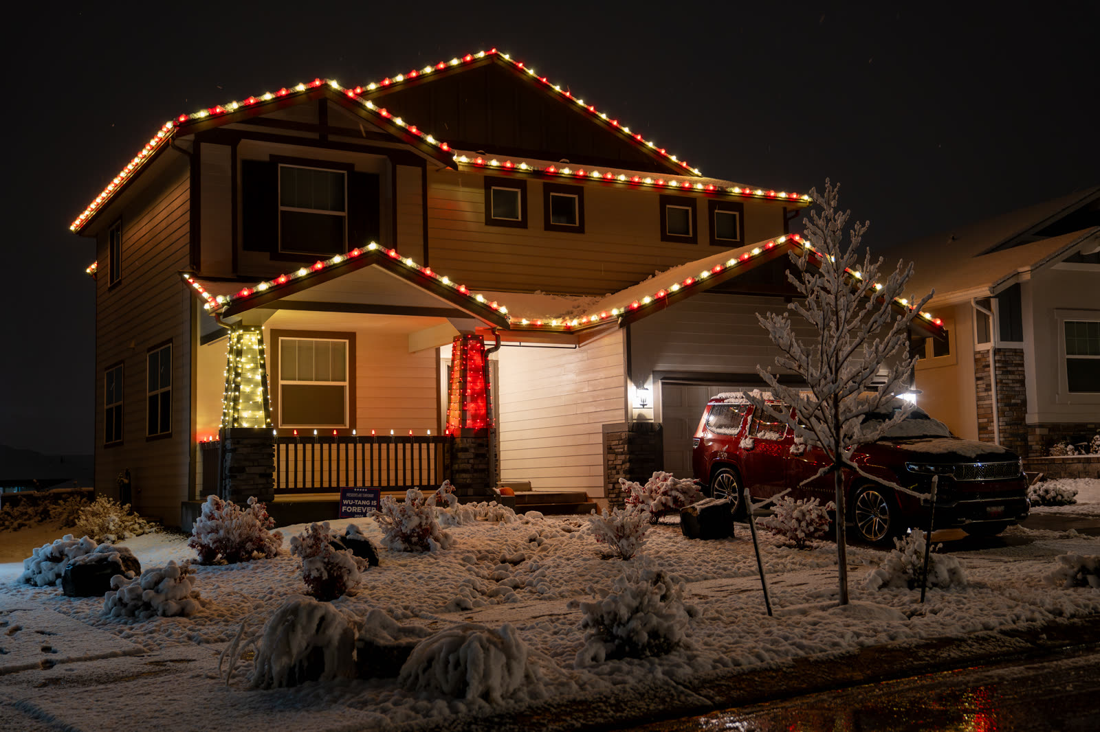 AFTERGLO Christmas light installation, red and gold roofline